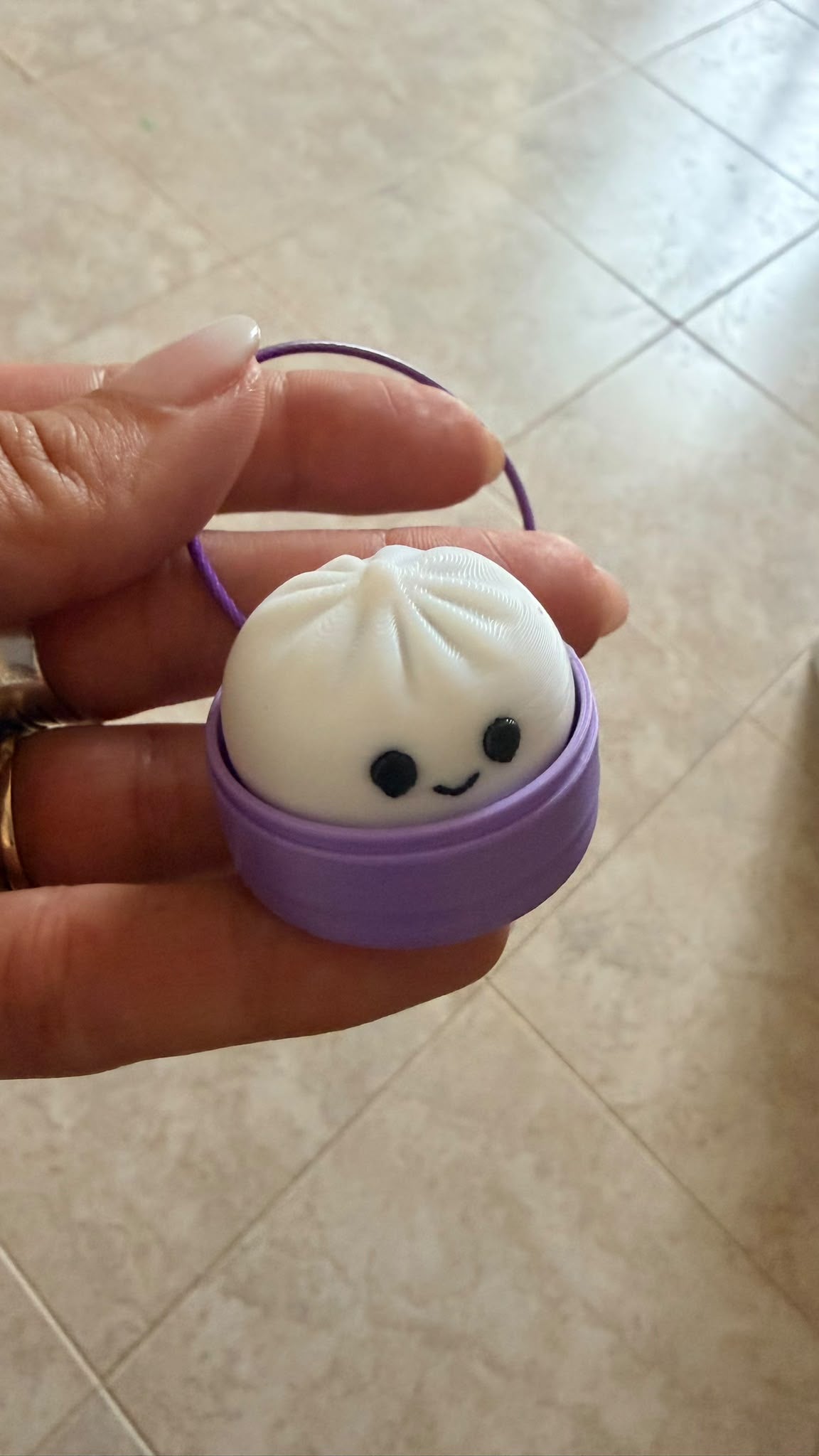 Llavero dumpling clicker color lila